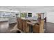 Spacious open-concept living area features a dining space, fireplace, and sliding barn door at 511 Island Way, Clearwater Beach, FL 33767