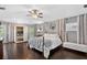 Bright main bedroom features ample natural light, wood floors, and a luxurious sauna at 511 Island Way, Clearwater Beach, FL 33767