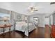 Comfortable main bedroom features ample natural light, wood floors, and ceiling fan at 511 Island Way, Clearwater Beach, FL 33767
