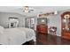Spacious main bedroom boasts wood floors, ample storage, and large television screen at 511 Island Way, Clearwater Beach, FL 33767
