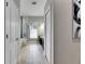 Spacious bathroom featuring double vanities, walk-in shower, bathtub and modern tile flooring at 5117 Whispering Leaf Trl, Valrico, FL 33596