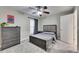 This bedroom features a ceiling fan and is freshly painted at 5117 Whispering Leaf Trl, Valrico, FL 33596