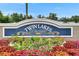 Beautifully landscaped Twin Lakes of Brandon community sign with vibrant flowers in the foreground at 5117 Whispering Leaf Trl, Valrico, FL 33596
