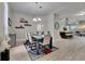 Dining room and open concept floorplan with kitchen island and living space visible at 5117 Whispering Leaf Trl, Valrico, FL 33596