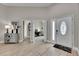 Inviting foyer with decorative touches leads to office and main living areas at 5117 Whispering Leaf Trl, Valrico, FL 33596