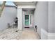 Inviting home entrance features a charming courtyard with decorative stone and covered doorway at 5117 Whispering Leaf Trl, Valrico, FL 33596
