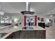 Gourmet kitchen has granite countertops, stainless hood, and is open to great room and outdoor spaces at 5117 Whispering Leaf Trl, Valrico, FL 33596