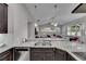 Kitchen features stainless appliances, granite countertops and open layout at 5117 Whispering Leaf Trl, Valrico, FL 33596