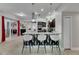 Stylish kitchen with modern countertops, stainless appliances, and convenient bar seating at 5117 Whispering Leaf Trl, Valrico, FL 33596