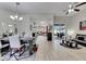 Open floor plan showcases dining area leading to a kitchen and outdoor entertainment space at 5117 Whispering Leaf Trl, Valrico, FL 33596
