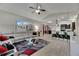 Open living room with stylish decor seamlessly connects to the kitchen for easy entertaining and comfortable living at 5117 Whispering Leaf Trl, Valrico, FL 33596
