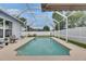 Relax by the refreshing screened-in pool, an ideal setting for outdoor entertainment and leisure at 5117 Whispering Leaf Trl, Valrico, FL 33596