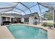 Enjoy the tranquility of this screened-in pool, creating a serene outdoor living space at 5117 Whispering Leaf Trl, Valrico, FL 33596