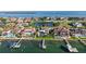 Waterfront homes with private docks, pools, and lush landscaping, showcasing the luxurious lifestyle and waterfront access at 5287 61St S Ave, St Petersburg, FL 33715
