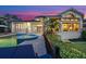 Custom pool with spa and covered lanai offer ultimate relaxation in this luxurious backyard setting at 5287 61St S Ave, St Petersburg, FL 33715