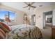 This bedroom is warm and inviting with a comfy bed and a window view of the outside cityscape at 5287 61St S Ave, St Petersburg, FL 33715