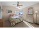 Cozy bedroom with natural light, floral bedding, and a chest of drawers at 5287 61St S Ave, St Petersburg, FL 33715