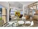 Bright breakfast nook with a glass-top table and waterfront views, adjoined with the living room at 5287 61St S Ave, St Petersburg, FL 33715