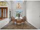 Bright dining room with large windows, a chandelier, and an expansive dining table at 5287 61St S Ave, St Petersburg, FL 33715