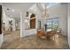 Bright dining room with large windows, chandelier, and decorative woodwork and entrance to living room at 5287 61St S Ave, St Petersburg, FL 33715