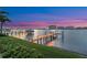 Beautiful evening view of private boat dock and lift, waterfront vistas and neighborhood skyline at 5287 61St S Ave, St Petersburg, FL 33715
