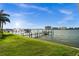 Beautiful waterfront view with a dock and boat lift, perfect for enjoying the water at 5287 61St S Ave, St Petersburg, FL 33715