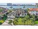 Beautiful waterfront home with lush landscaping and a spacious three-car garage in a tropical paradise at 5287 61St S Ave, St Petersburg, FL 33715