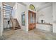Grand foyer with high ceilings, a wooden staircase, and large windows that provide natural light at 5287 61St S Ave, St Petersburg, FL 33715