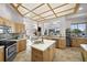Well-lit kitchen with custom cabinets, stainless steel appliances, and open layout at 5287 61St S Ave, St Petersburg, FL 33715