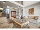 Cozy living room with elegant seating, high ceilings, and a decorative painting on the wall at 5287 61St S Ave, St Petersburg, FL 33715