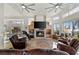 Bright living room features water views, a fireplace, and an open concept layout at 5287 61St S Ave, St Petersburg, FL 33715