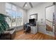 Well-lit office space with large windows, hardwood floors, and a comfortable chair and desk at 5287 61St S Ave, St Petersburg, FL 33715