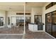 Covered patio with full outdoor kitchen with sink and grill, dining area and water views at 5287 61St S Ave, St Petersburg, FL 33715