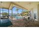 Relaxing patio with stunning waterfront views, a sparkling pool, and comfortable seating for outdoor enjoyment at 5287 61St S Ave, St Petersburg, FL 33715