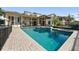 A backyard pool with a hot tub and surrounding patio, creating a serene outdoor oasis for leisure and enjoyment at 5287 61St S Ave, St Petersburg, FL 33715