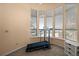 Bright exercise room with large windows offering views of the outside, and a treadmill at 5287 61St S Ave, St Petersburg, FL 33715