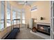 Bright sun room with large windows, a fireplace, and a treadmill for exercise and relaxation at 5287 61St S Ave, St Petersburg, FL 33715