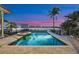 Beautiful pool and spa overlooking the water, perfect for relaxation and entertaining at dusk at 5287 61St S Ave, St Petersburg, FL 33715