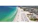 Stunning beach view with clear water, resorts, and plenty of sunshine at 5445 Gulf Blvd # 210, St Pete Beach, FL 33706
