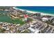 Gorgeous aerial view showcasing this beachfront condo community near the Gulf Coast beaches and local shops at 5445 Gulf Blvd # 210, St Pete Beach, FL 33706