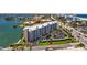 Waterfront condo building featuring private balconies and parking at 5445 Gulf Blvd # 210, St Pete Beach, FL 33706