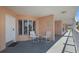Inviting covered balcony with seating, perfect for relaxing outdoors at 5445 Gulf Blvd # 210, St Pete Beach, FL 33706