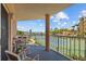 Enjoy tennis court views from this condo balcony with seating for outdoor relaxation and dining at 5445 Gulf Blvd # 210, St Pete Beach, FL 33706