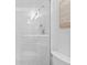 Bright bathroom with tiled shower, glass door, and modern fixtures at 5445 Gulf Blvd # 210, St Pete Beach, FL 33706
