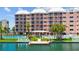 Waterfront condo with community pool, tennis court, dock, and lush landscaping at 5445 Gulf Blvd # 210, St Pete Beach, FL 33706