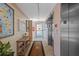 Hallway with decor and elevator access, a cozy entrance to your new home at 5445 Gulf Blvd # 210, St Pete Beach, FL 33706
