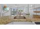 Kitchen with granite countertops, stainless steel sink, and bright natural light at 5445 Gulf Blvd # 210, St Pete Beach, FL 33706