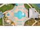 Aerial view of a community pool with lounge chairs and seating at 5445 Gulf Blvd # 210, St Pete Beach, FL 33706