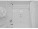 This bathroom features a tub and shower combination with white tiling and shower curtain at 5445 Gulf Blvd # 210, St Pete Beach, FL 33706
