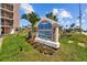 Sign for Sunrise Resort condo resort, with monthly rentals and contact information at 5445 Gulf Blvd # 210, St Pete Beach, FL 33706